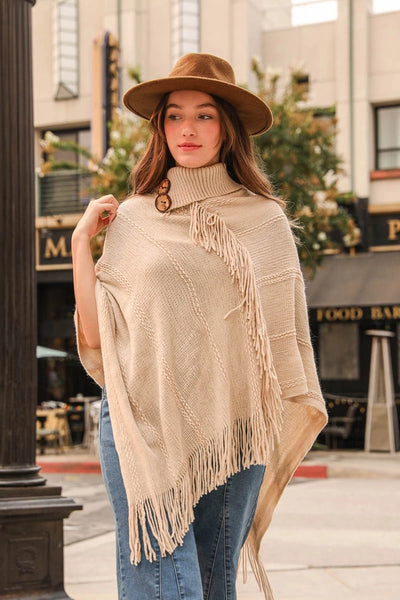button neck poncho with fringe oatmeal